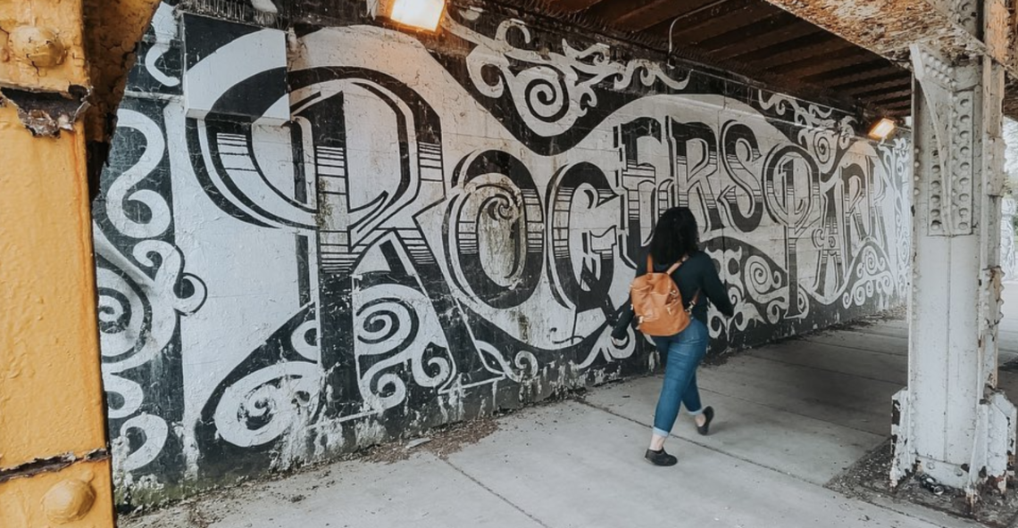 Jazmin Marie walking past mural in Rogers Park, Chicago, Illinois. Mural in Rogers Park, Chicago, Illinois - Jazmin Marie - Women's Lifestyle Travel blog - Free Admission Attractions in Chicago, Illinois